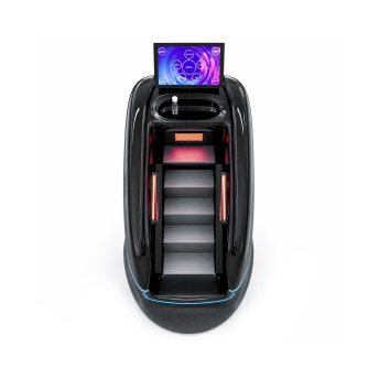 Cabina benessere futuristica di colore nero con gradini illuminati simili a tapis roulant e un touchscreen superiore che visualizza un'interfaccia utente circolare.
