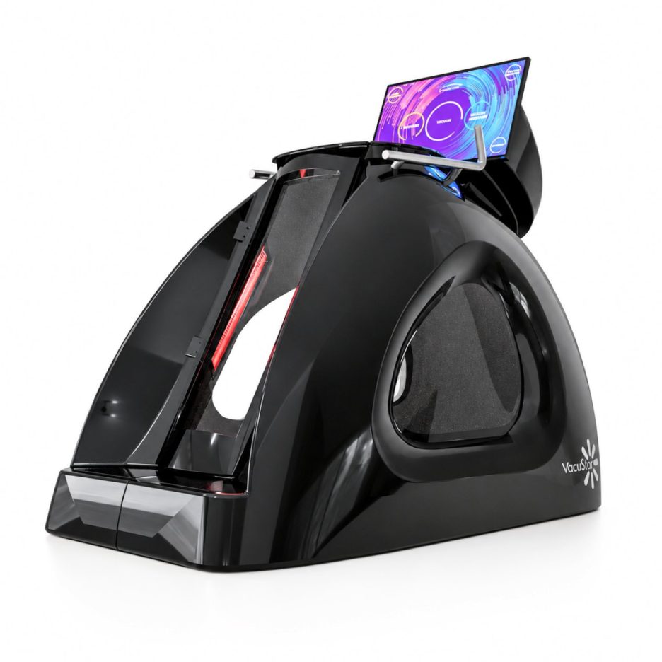 Sleek black medical device with curved housing and a touchscreen mounted on top; VacuStar logo visible.